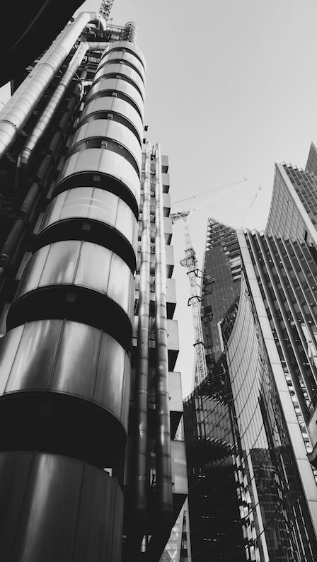 The Lloyd's building in London in black and white with heavy shadows
